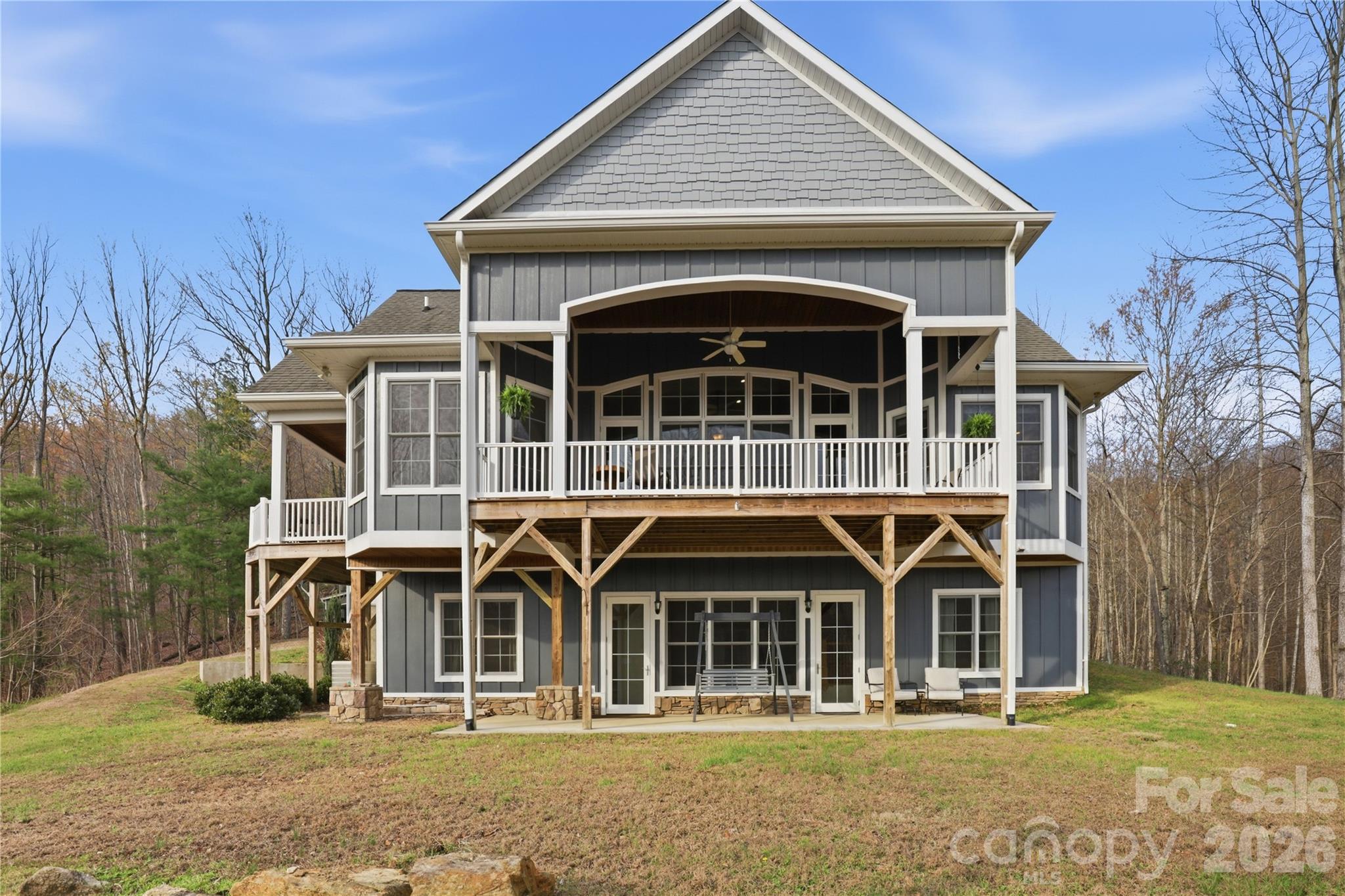 1084 Rocky Headwaters Road Moravian Falls, NC 28654 - Photo 2 of 43 a front view of a house with large windows