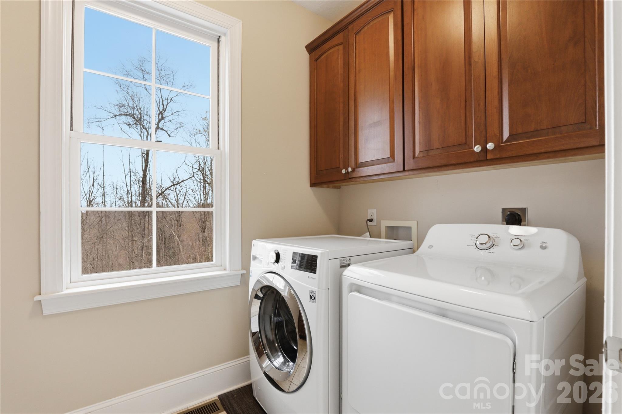 1084 Rocky Headwaters Road Moravian Falls, NC 28654 - Photo 22 of 43 a utility room with dryer and washer