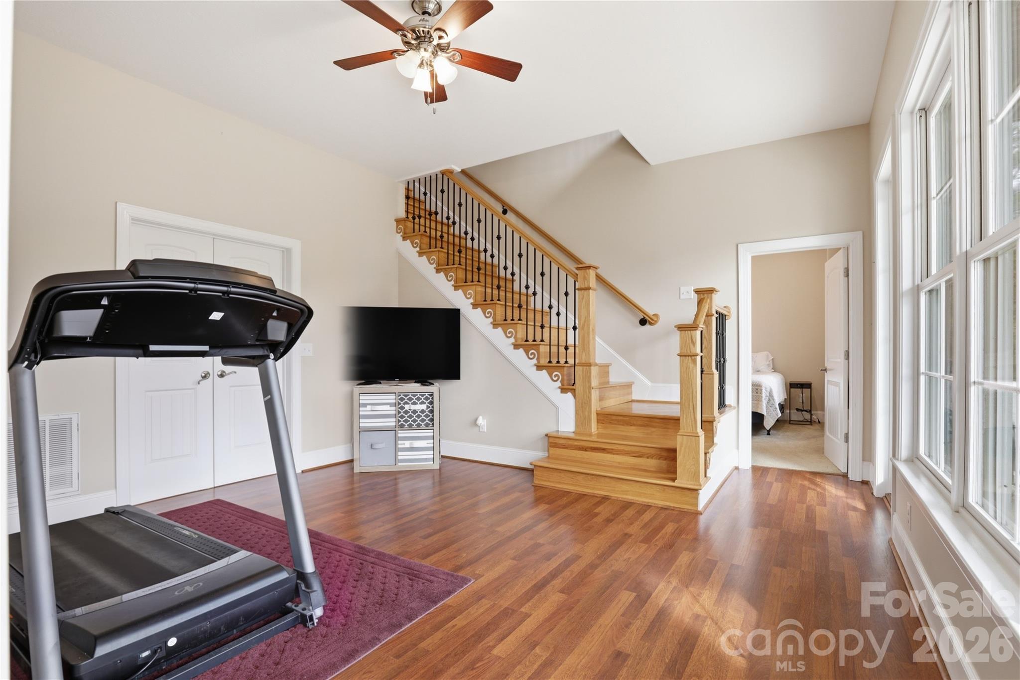 1084 Rocky Headwaters Road Moravian Falls, NC 28654 - Photo 30 of 43 a living room with wooden floor and white walls