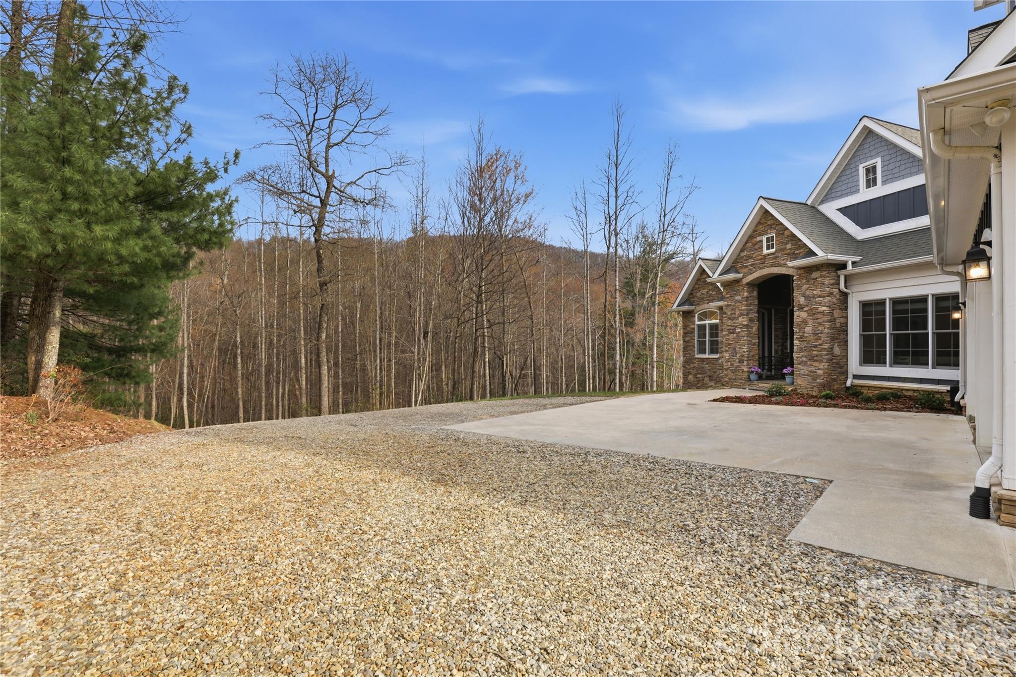 1084 Rocky Headwaters Road Moravian Falls, NC 28654 - Photo 40 of 43 a front view of a house with a yard and garage