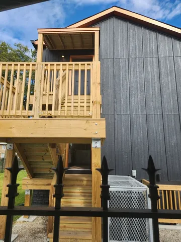 a front view of a house with parking area