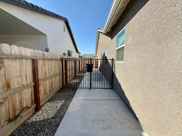 a view of balcony with wooden floor