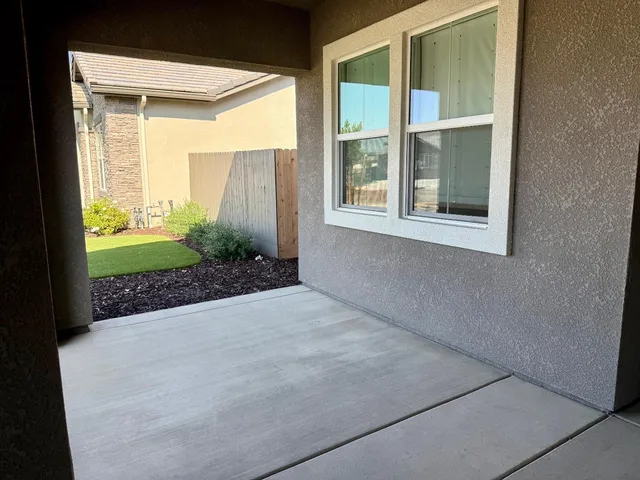 a view of a backyard with potted plants