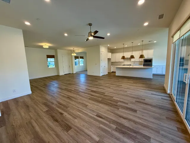 a view of a kitchen and a flat screen tv