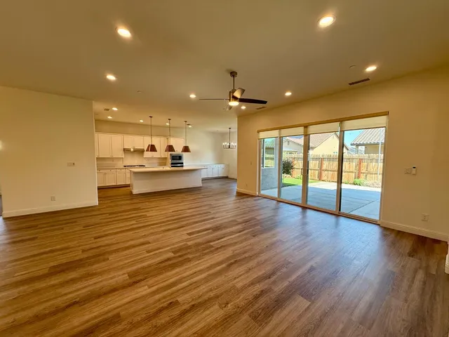 a view of a large kitchen with a large window