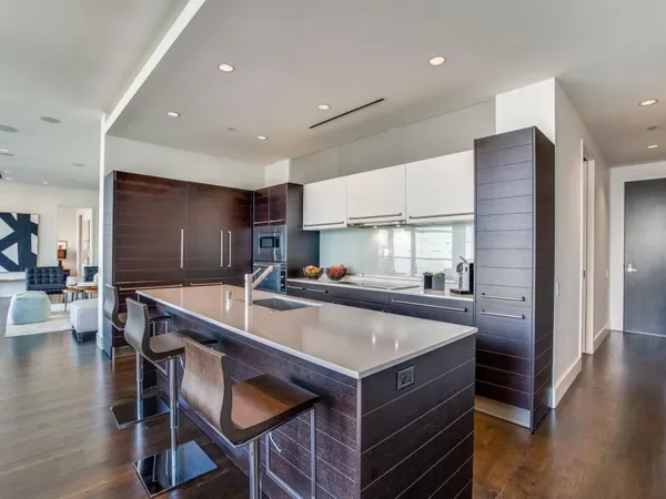 a kitchen with center island and stainless steel appliances