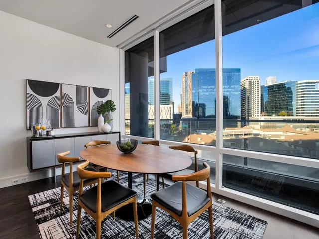 a view of a dining room with furniture and window