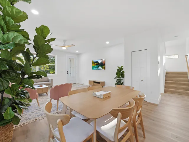 a kitchen with a white stove top oven and white cabinets