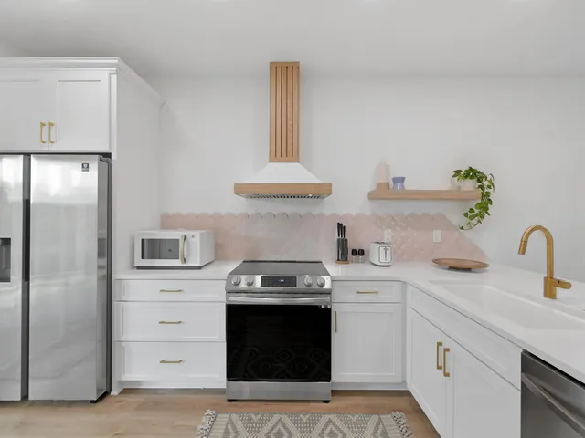a kitchen with a stove and a refrigerator