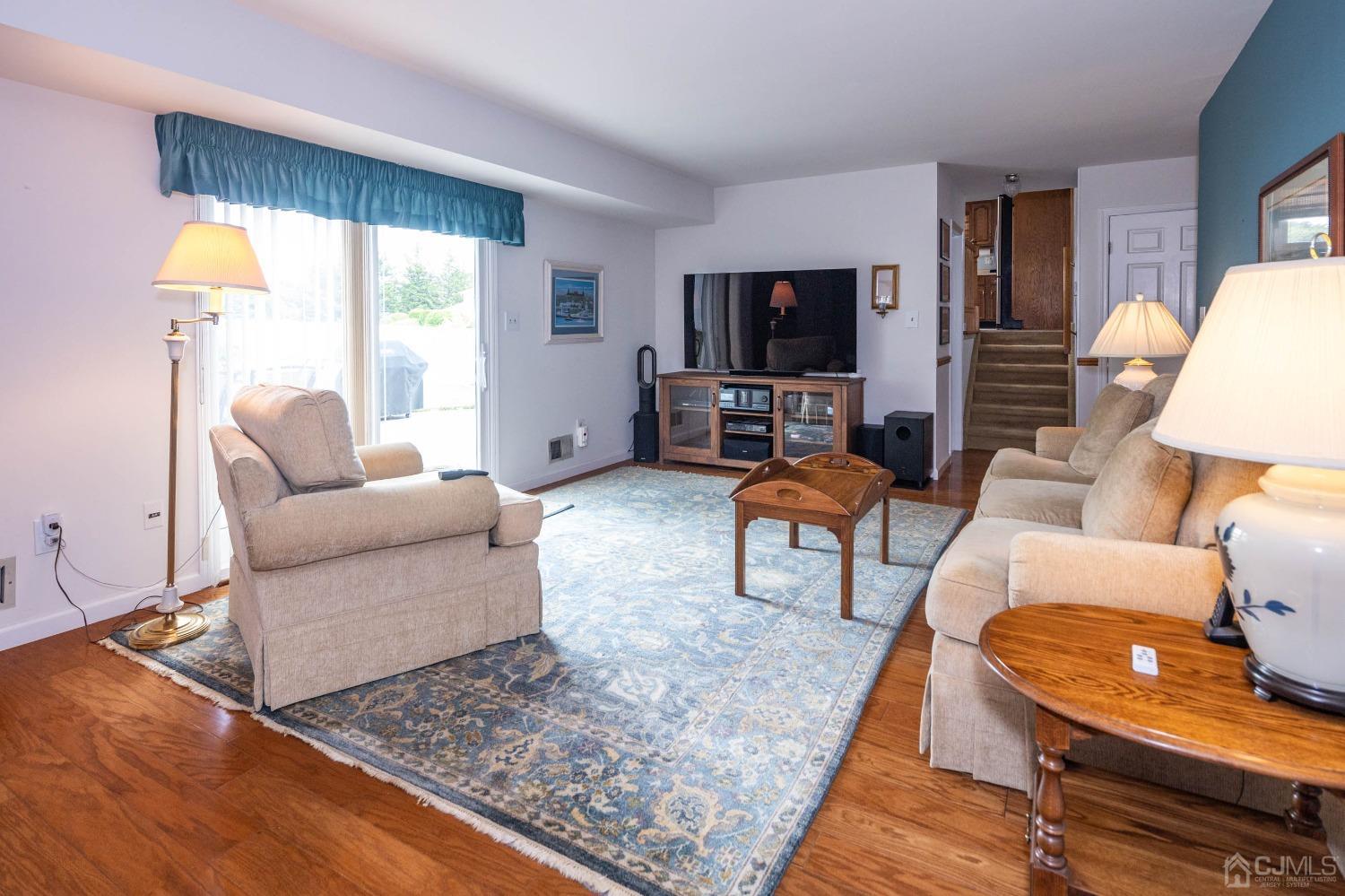 4 Overview Court Edison, NJ 08817 - Photo 21 of 44 a living room with furniture and a flat screen tv