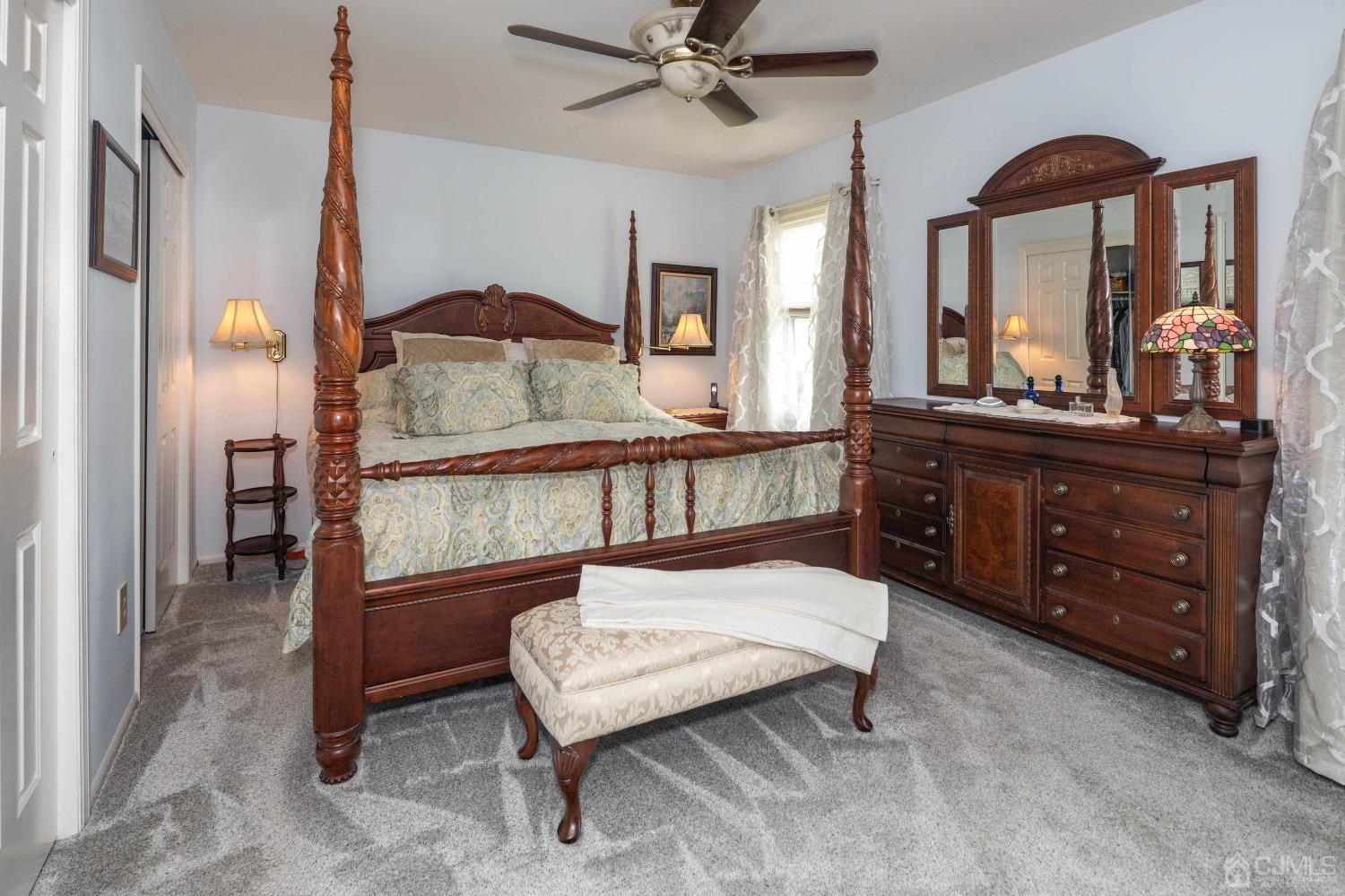 4 Overview Court Edison, NJ 08817 - Photo 23 of 44 a bedroom with a bed and a mirror on dresser