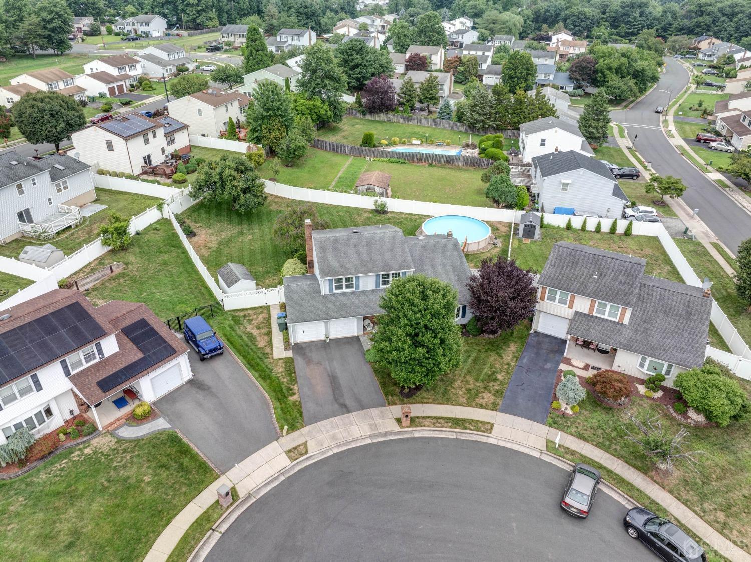 4 Overview Court Edison, NJ 08817 - Photo 40 of 44 an aerial view of a house with a garden and lake view