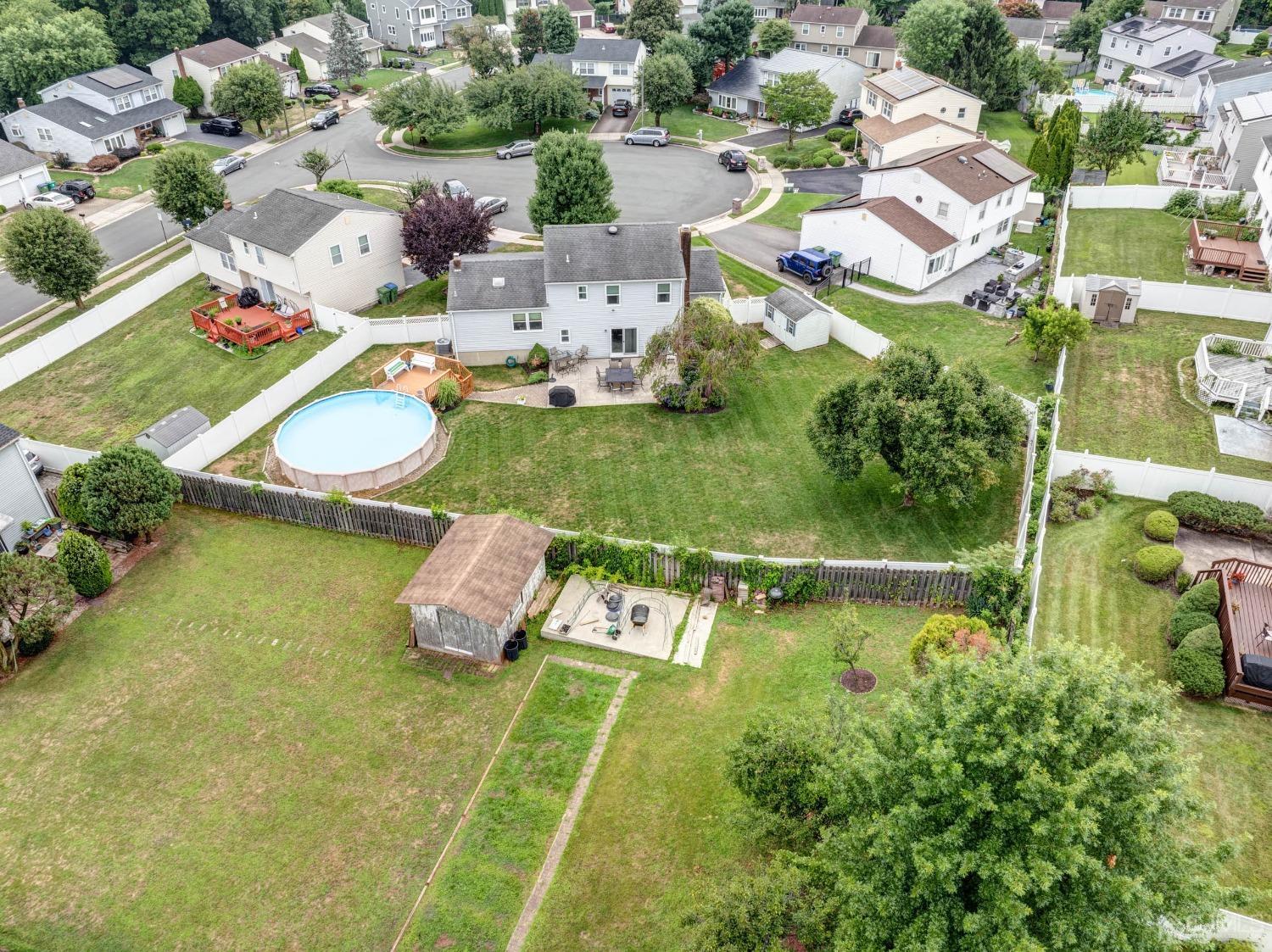 4 Overview Court Edison, NJ 08817 - Photo 44 of 44 an aerial view of a house with a swimming pool yard and outdoor seating