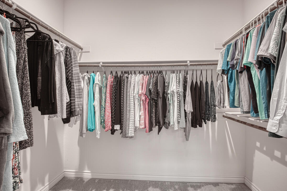 43775 Treviso Drive Indio, CA 92203 - Photo 15 of 47 a view of walk in closet with clothes and shoes