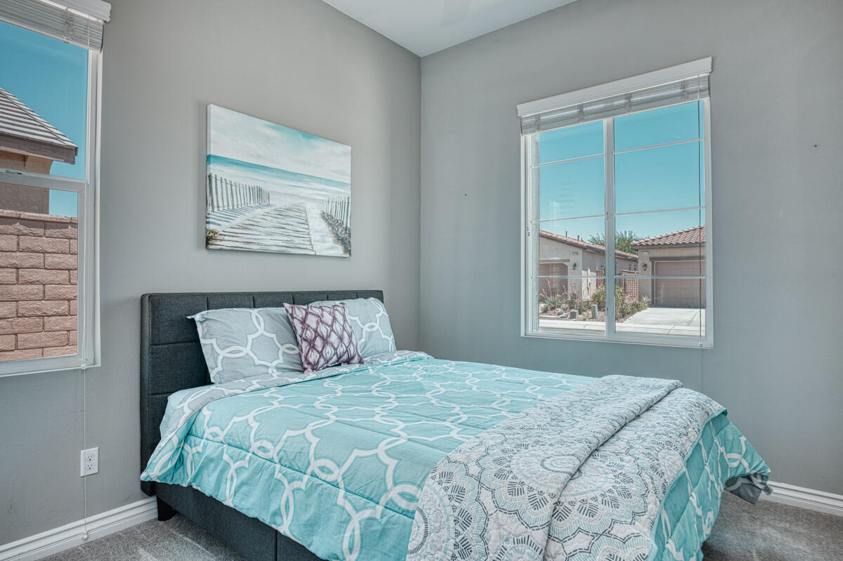 43775 Treviso Drive Indio, CA 92203 - Photo 16 of 47 a bedroom with a bed and a window