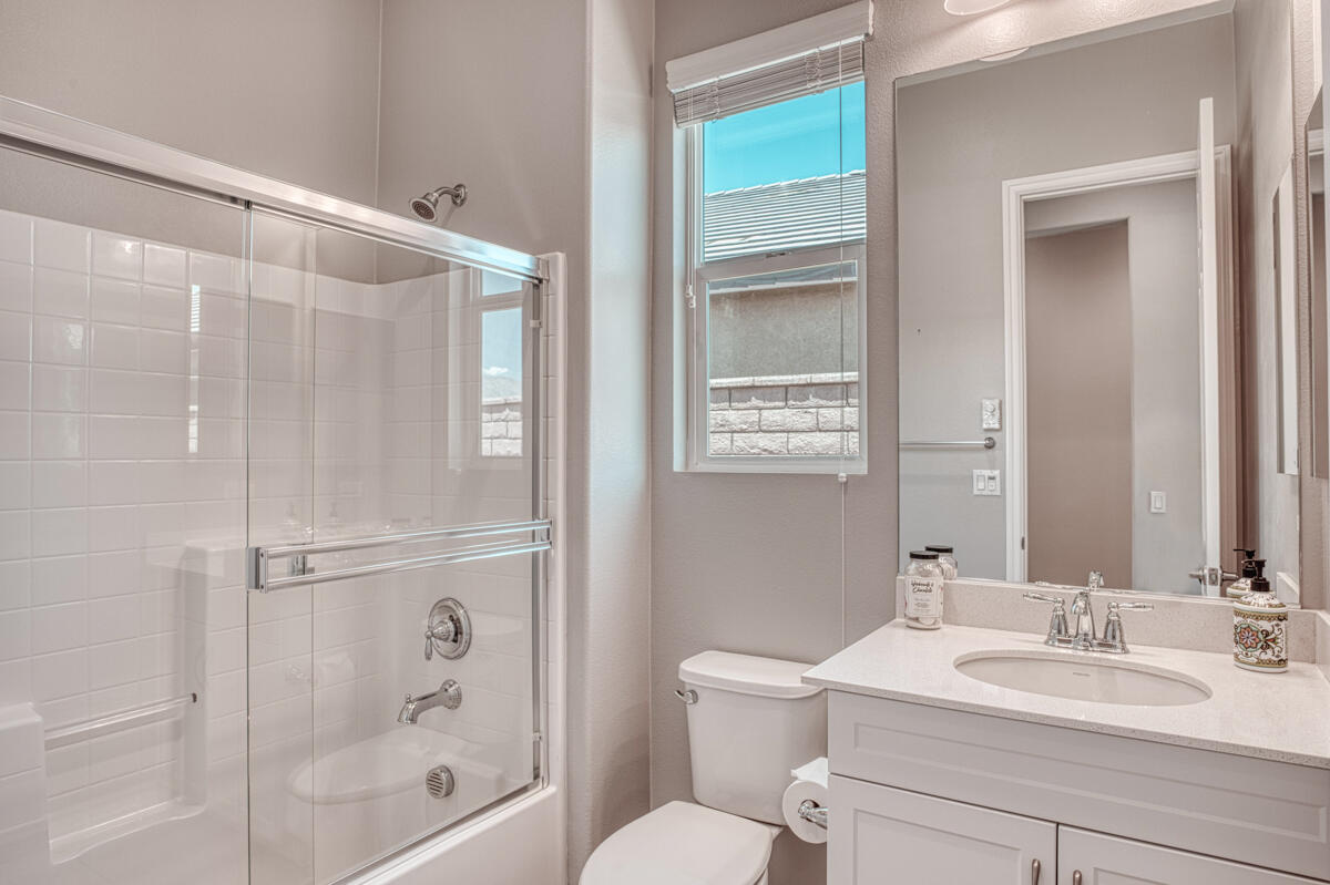 43775 Treviso Drive Indio, CA 92203 - Photo 17 of 47 a bathroom with a sink toilet and shower