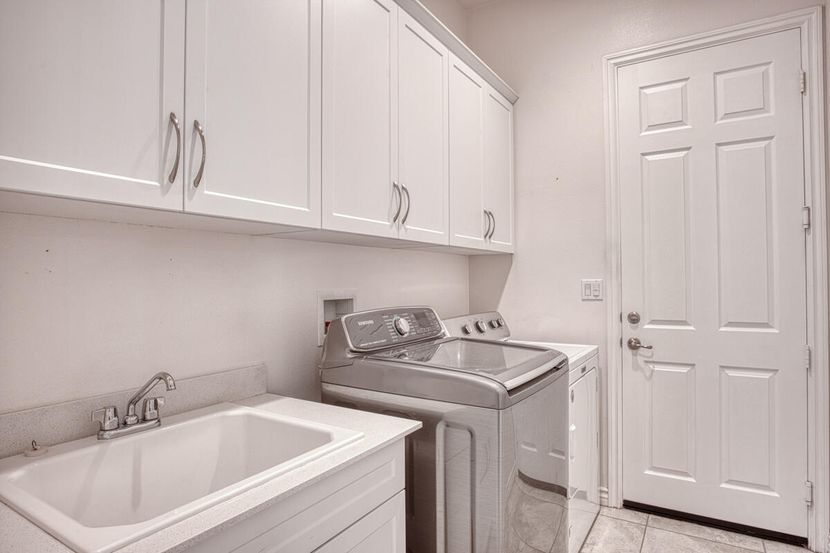 43775 Treviso Drive Indio, CA 92203 - Photo 19 of 47 a bathroom with a sink and cabinets