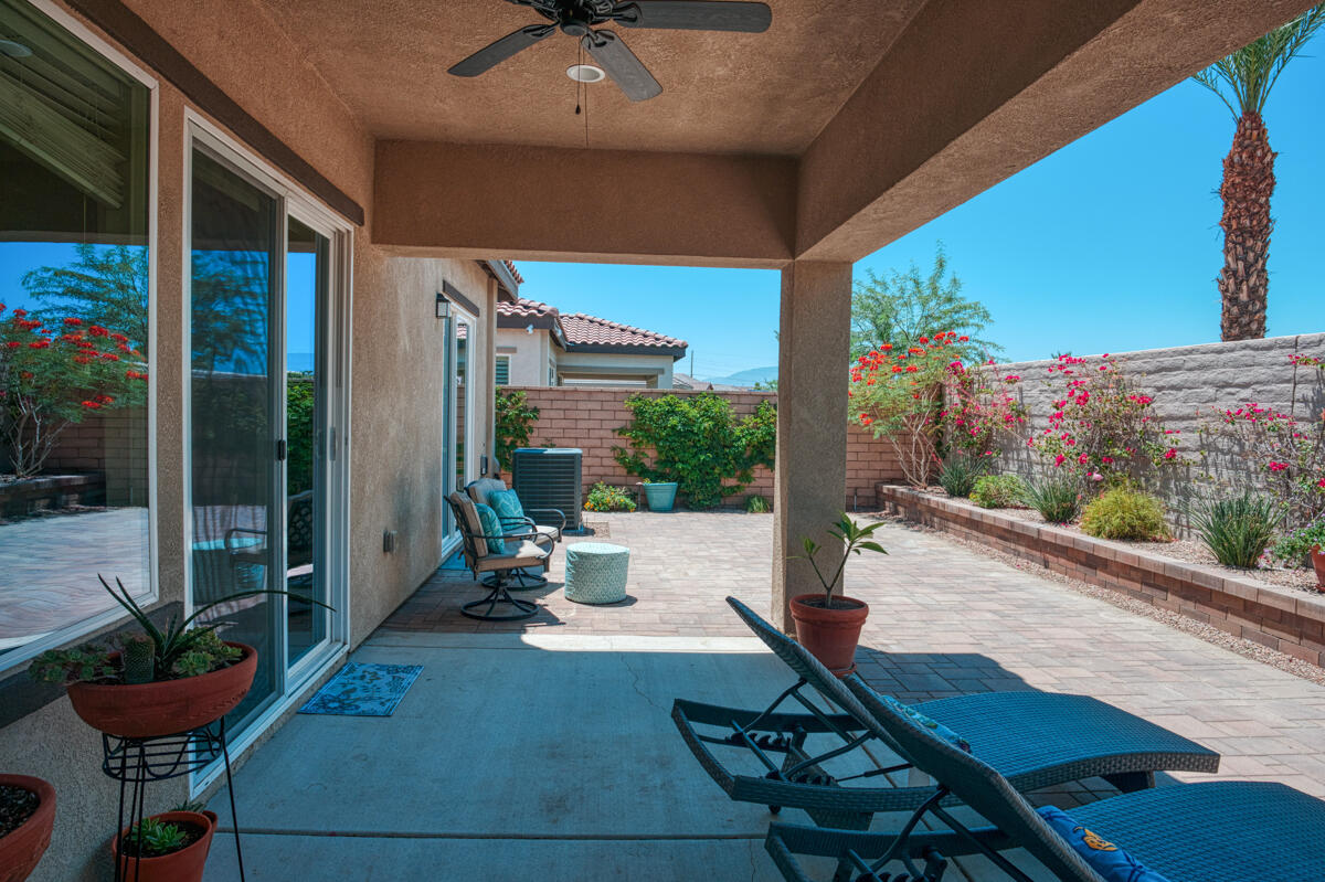 43775 Treviso Drive Indio, CA 92203 - Photo 23 of 47 a building outdoor space with patio furniture and potted plants