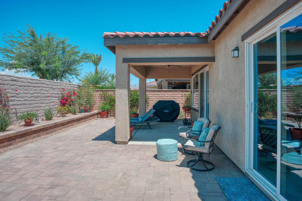 43775 Treviso Drive Indio, CA 92203 - Photo 24 of 47 a view of two chairs in the patio and a room