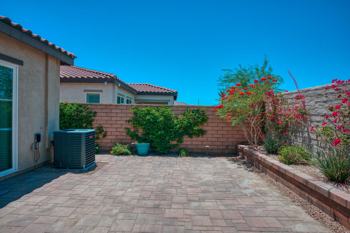 43775 Treviso Drive Indio, CA 92203 - Photo 26 of 47 a front view of a house with a yard