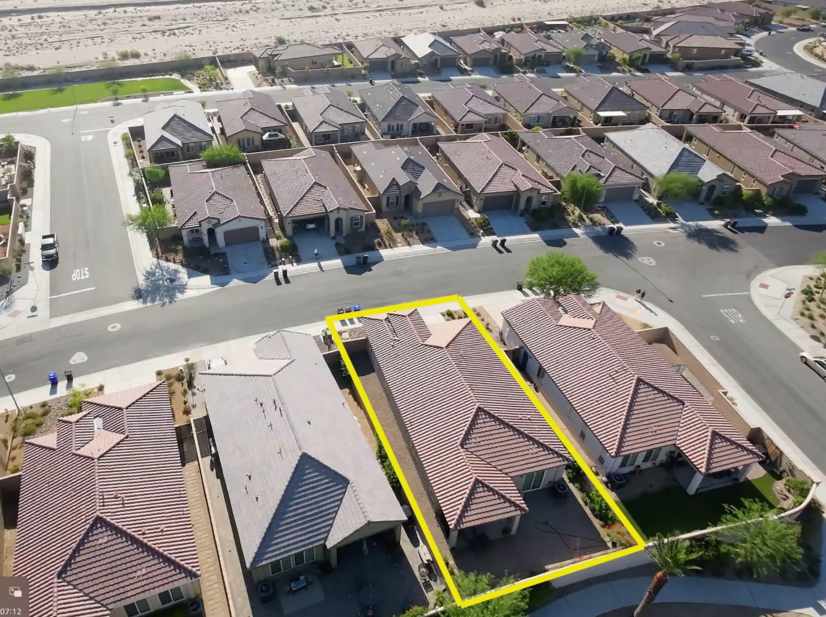 43775 Treviso Drive Indio, CA 92203 - Photo 29 of 47 an aerial view of a house with a swimming pool