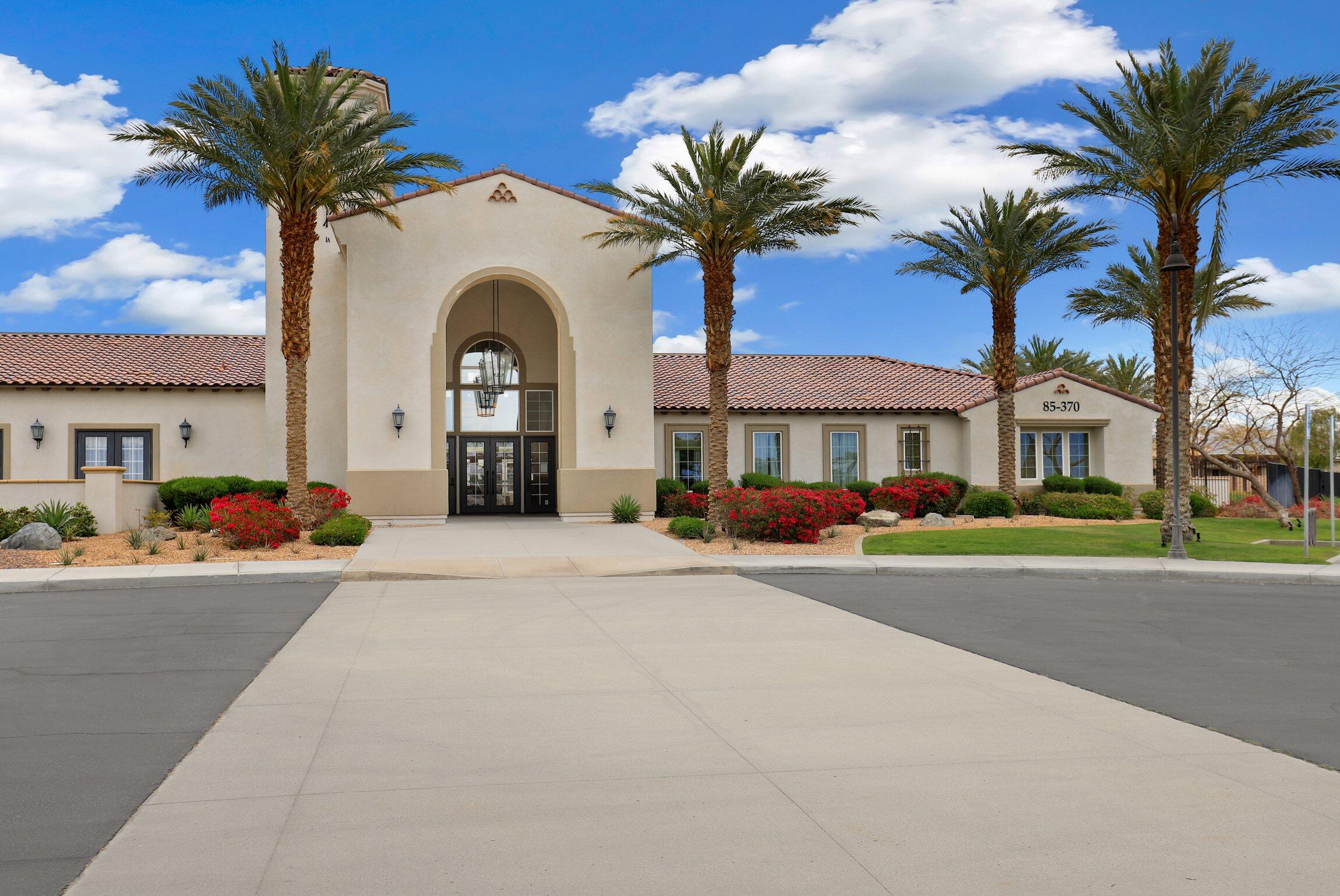 43775 Treviso Drive Indio, CA 92203 - Photo 33 of 47 a front view of a house with a garden and a garage