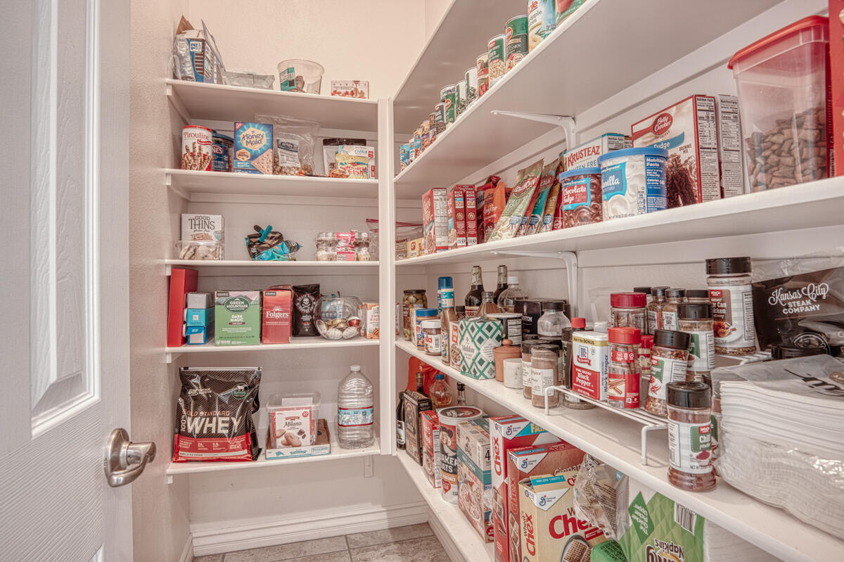 43775 Treviso Drive Indio, CA 92203 - Photo 7 of 47 a utility room with lots of clutter and cabinets