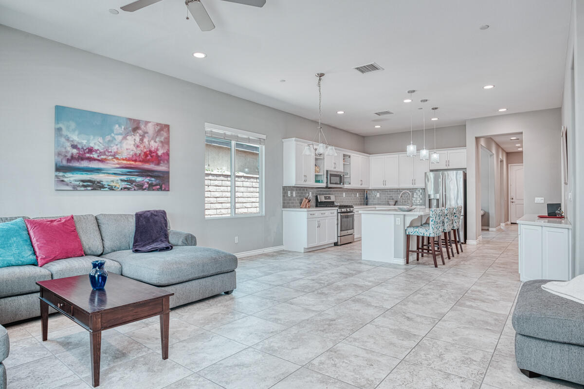43775 Treviso Drive Indio, CA 92203 - Photo 10 of 47 a living room with furniture and kitchen view