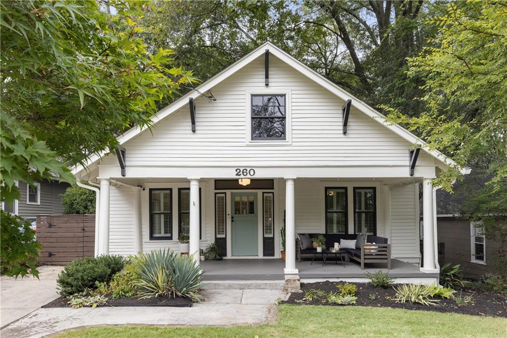 260 Mathews Avenue Northeast Atlanta, GA 30307 - Photo 1 of 1 a front view of house with yard outdoor seating and porch