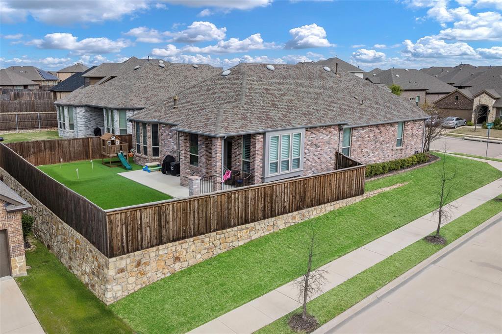 a view of a house with wooden fence