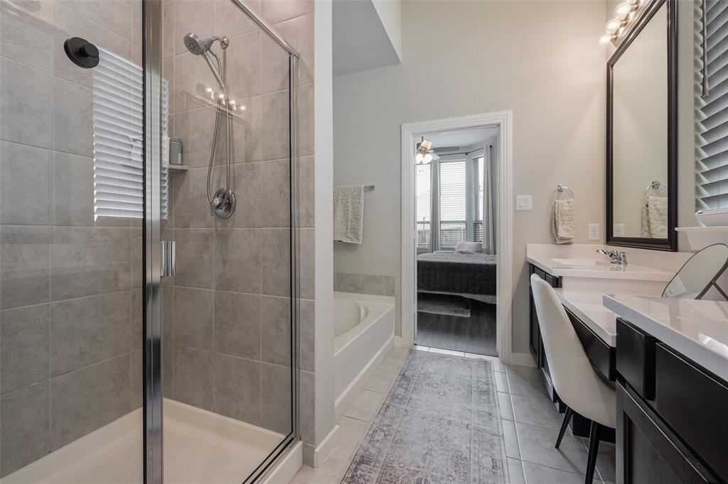 5664 Durst Lane Forney, TX 75126 - Photo 14 of 26 a bathroom with a granite countertop sink a toilet and shower
