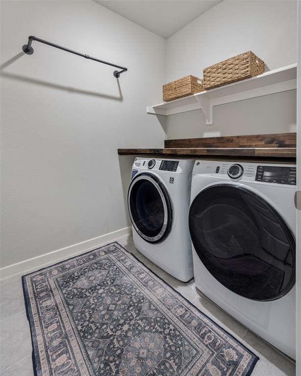 5664 Durst Lane Forney, TX 75126 - Photo 22 of 26 a utility room with dryer and washer