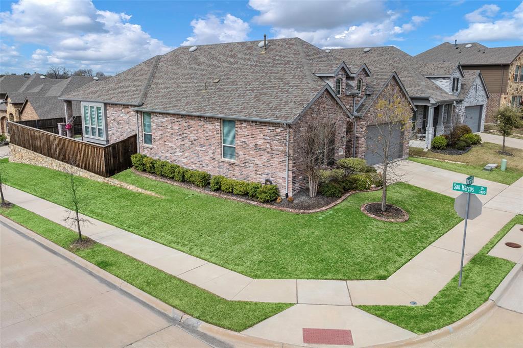 5664 Durst Lane Forney, TX 75126 - Photo 24 of 26 a aerial view of a house with a yard potted plants and wooden fence
