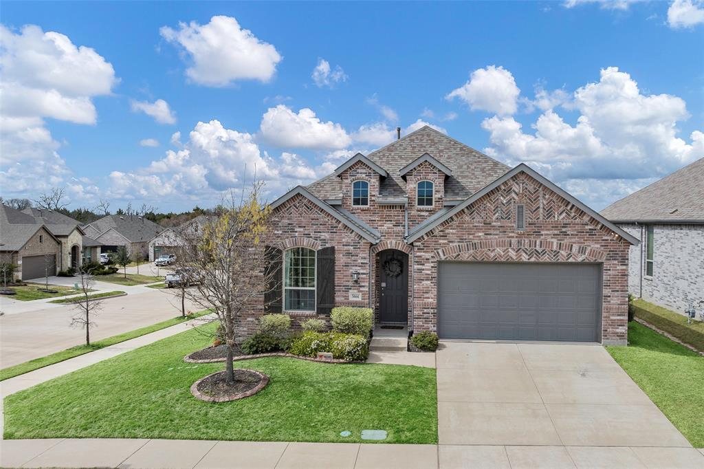 5664 Durst Lane Forney, TX 75126 - Photo 5 of 26 a front view of a house with garden