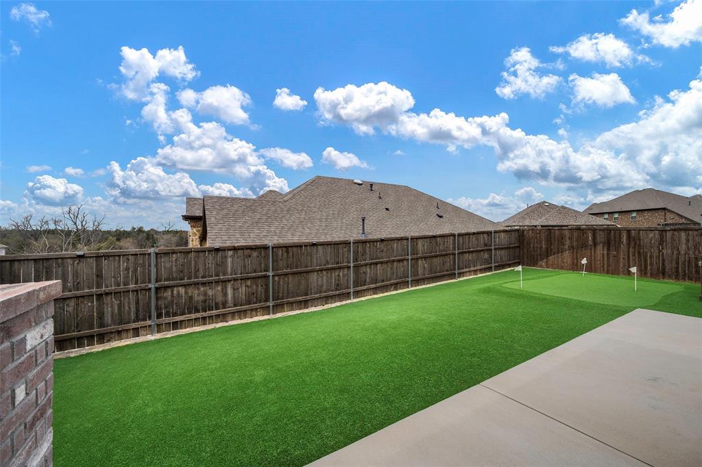 5664 Durst Lane Forney, TX 75126 - Photo 7 of 26 a view of a backyard with a garden