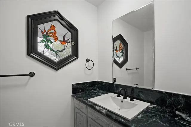 a bathroom with a sink and a mirror