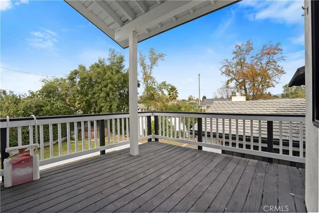 a view of balcony with wooden floor