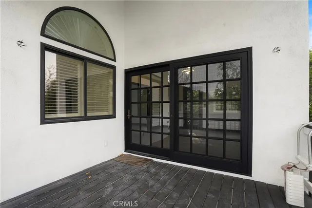 a view of wooden floor and brick wall