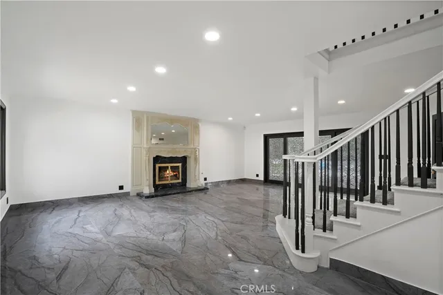 a view of a hallway with stairs