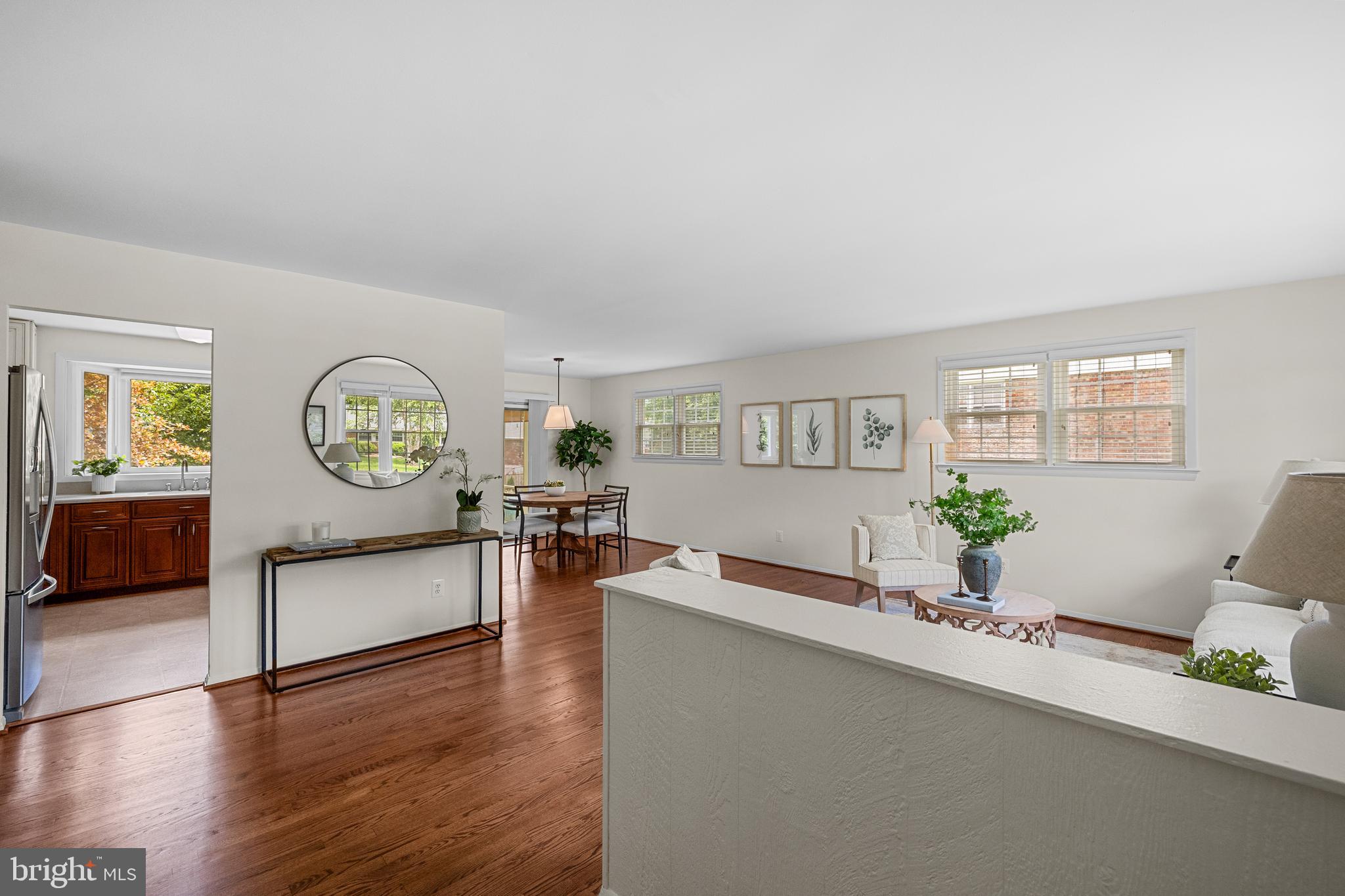 15007 Carlbern Drive Centreville, VA 20120 - Photo 11 of 47 a living room with furniture a large window and wooden floor