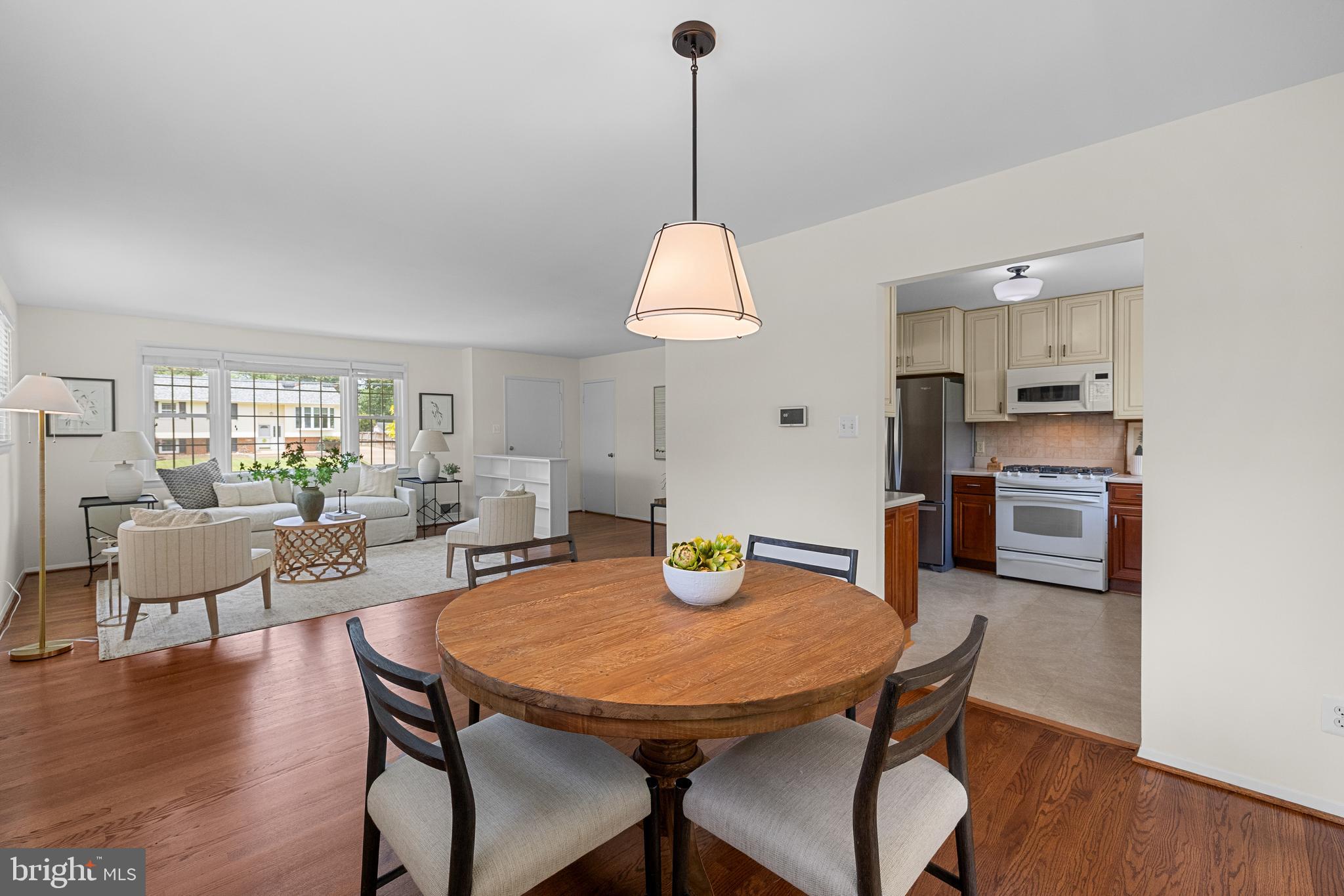 15007 Carlbern Drive Centreville, VA 20120 - Photo 18 of 47 a view of a dining room with furniture window and wooden floor