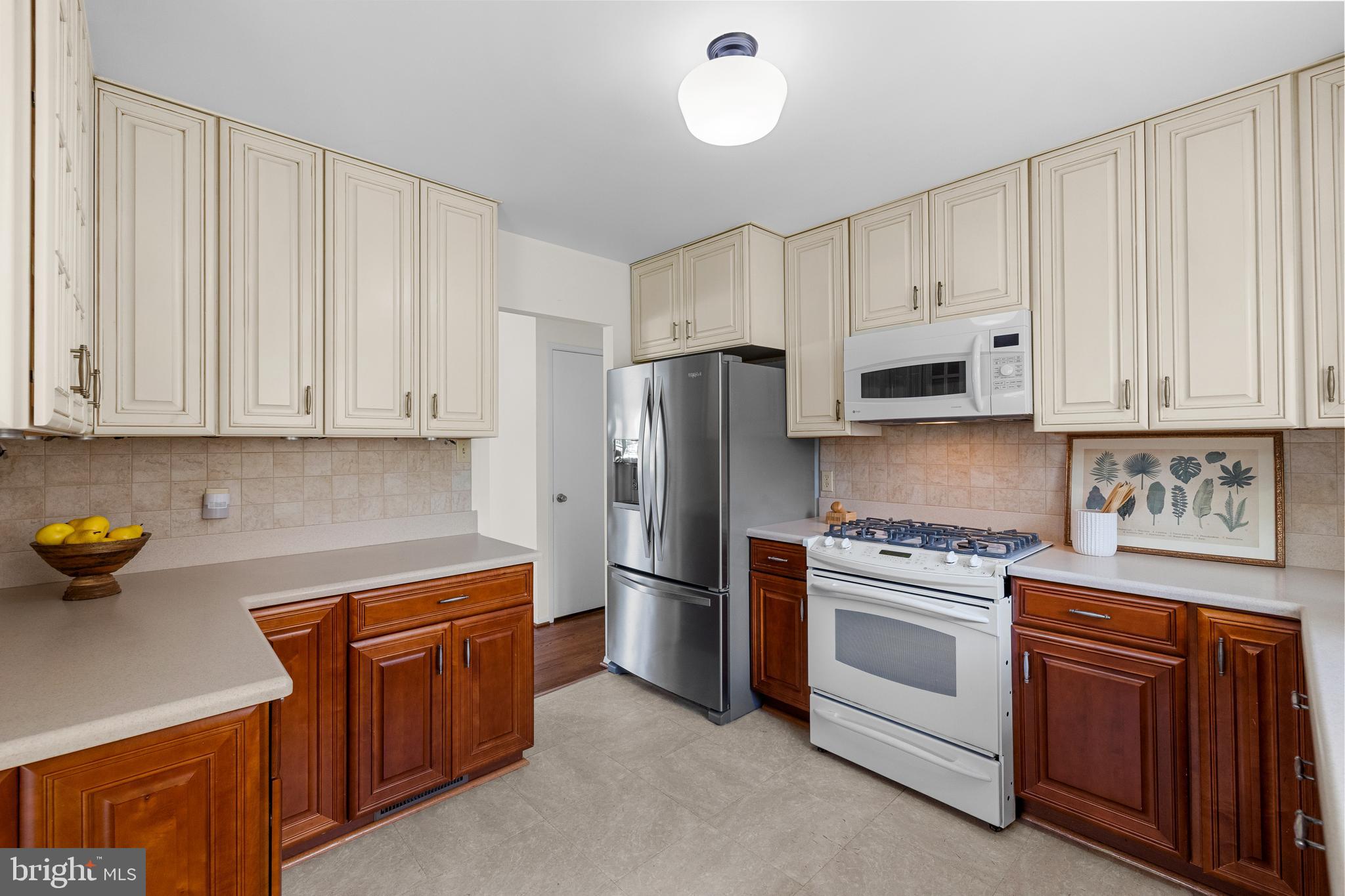 15007 Carlbern Drive Centreville, VA 20120 - Photo 20 of 47 a kitchen with stainless steel appliances white cabinets and a stove top oven