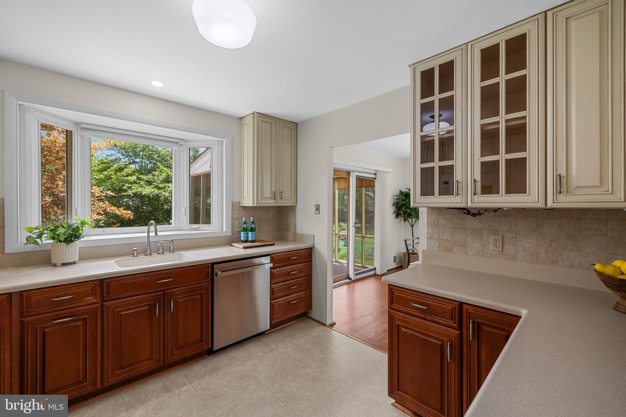 15007 Carlbern Drive Centreville, VA 20120 - Photo 22 of 47 a kitchen with stainless steel appliances granite countertop a sink and dishwasher a stove a refrigerator with wooden cabinets