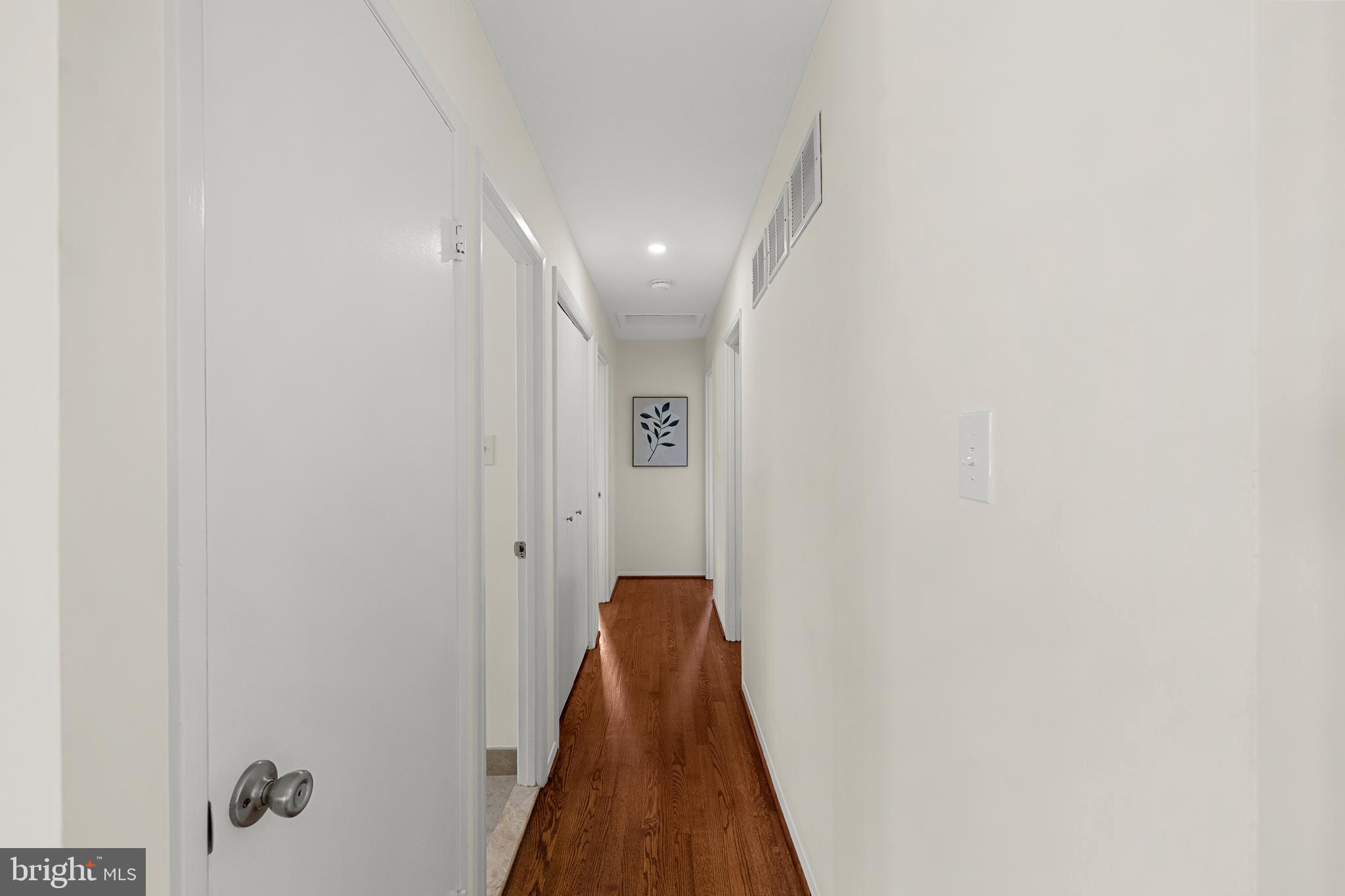 15007 Carlbern Drive Centreville, VA 20120 - Photo 26 of 47 a view of a hallway with a white walls