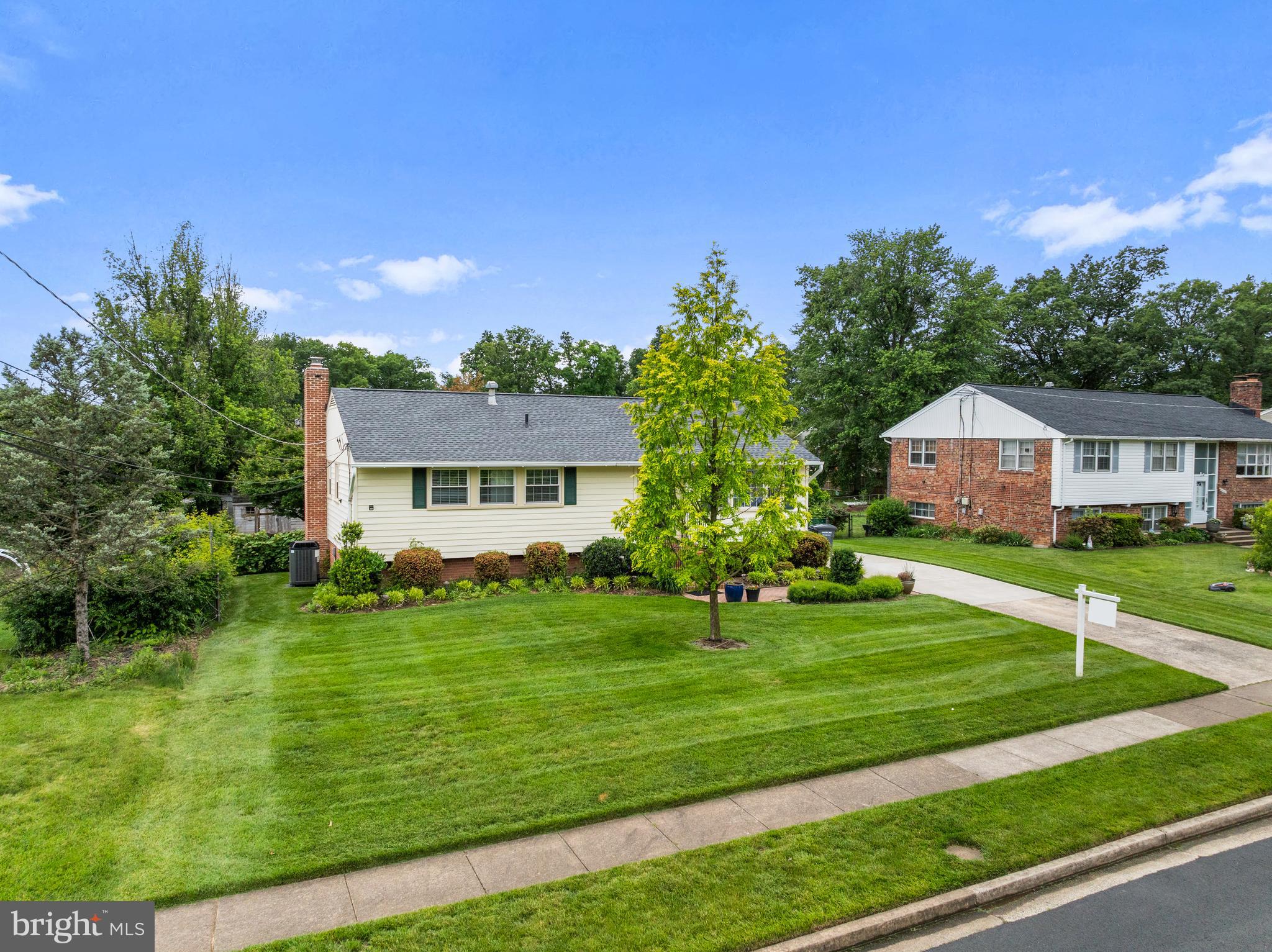 15007 Carlbern Drive Centreville, VA 20120 - Photo 3 of 47 a front view of a house with a garden