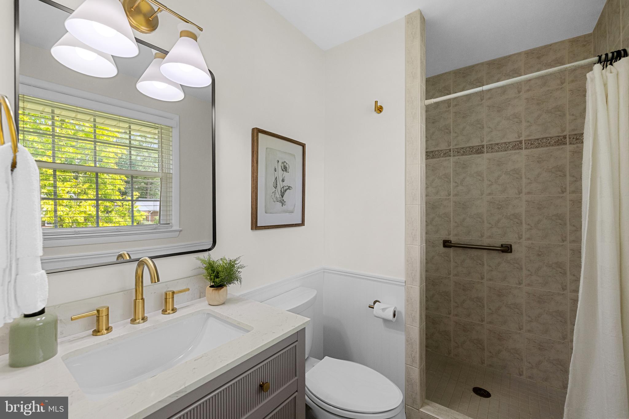 15007 Carlbern Drive Centreville, VA 20120 - Photo 31 of 47 a bathroom with a sink a toilet and shower