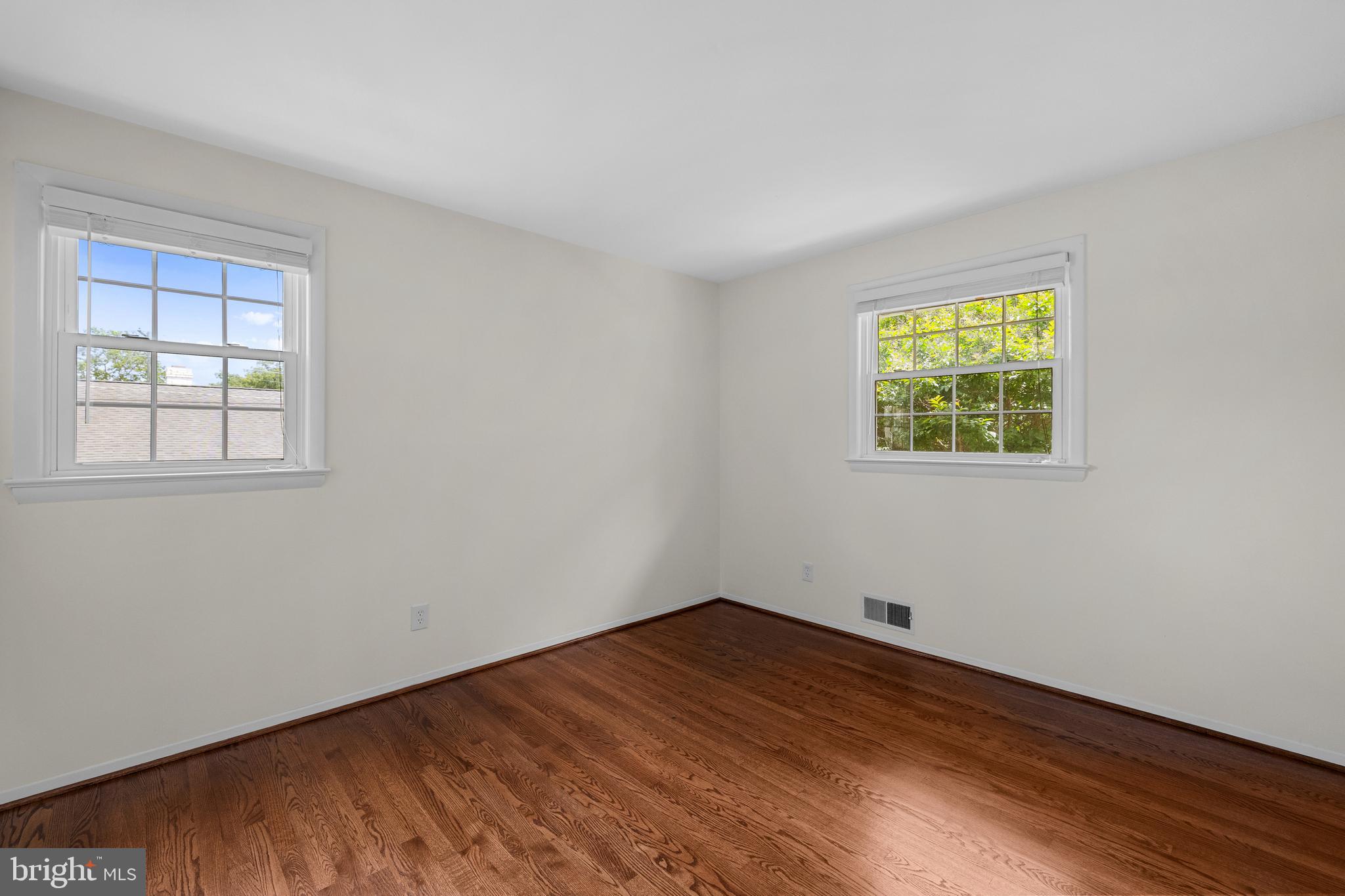 15007 Carlbern Drive Centreville, VA 20120 - Photo 33 of 47 a view of empty room with wooden floor and fan