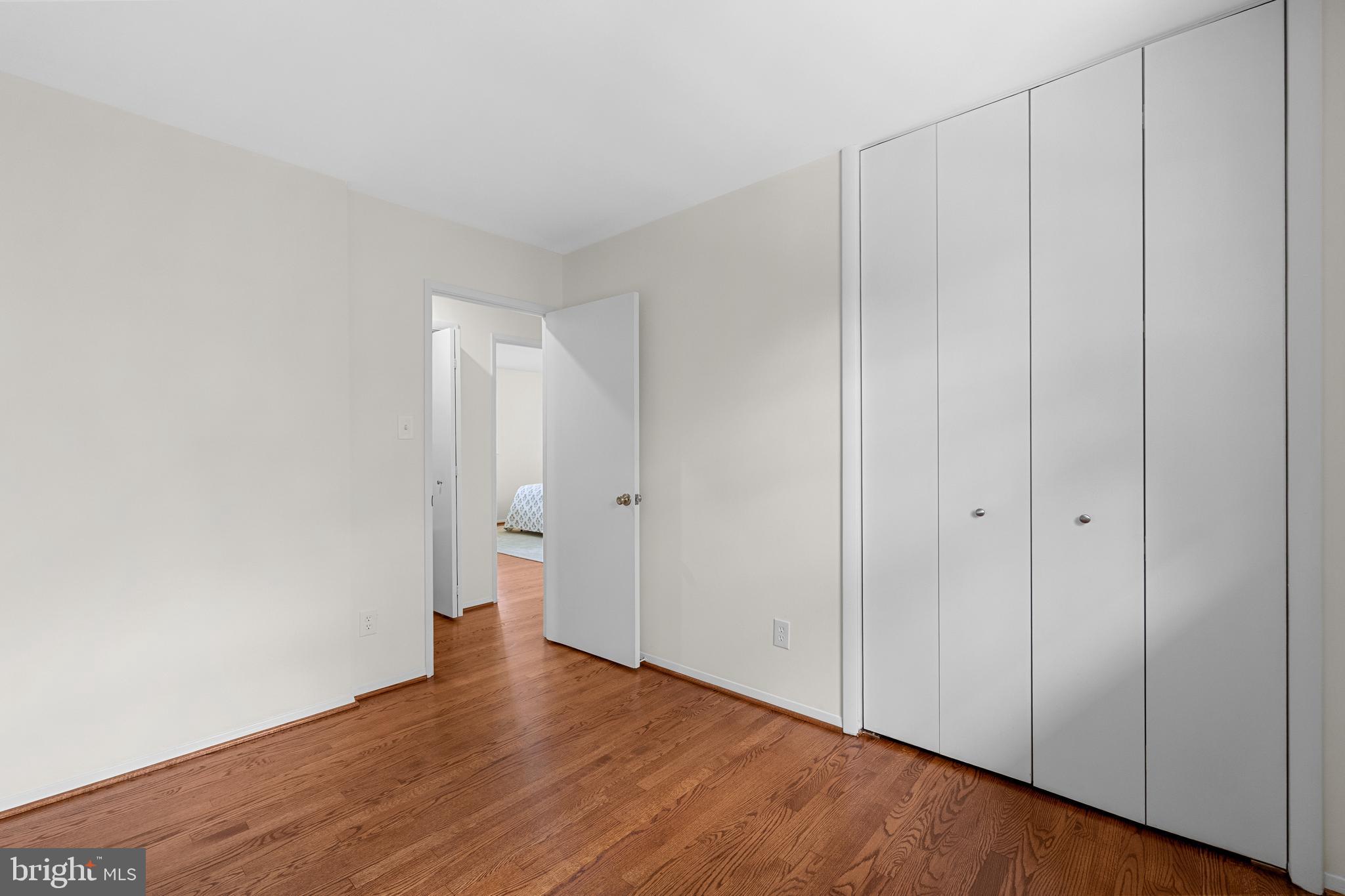 15007 Carlbern Drive Centreville, VA 20120 - Photo 36 of 47 a view of an empty room with wooden floor