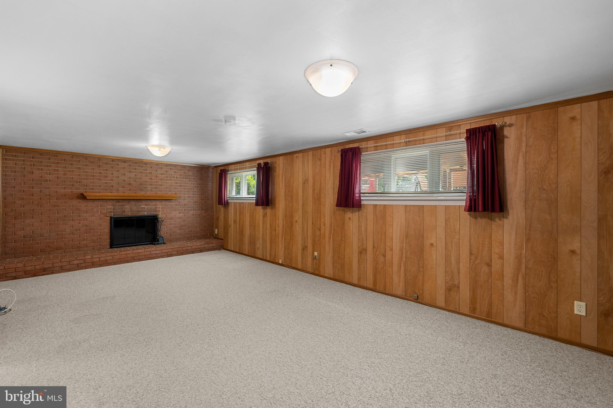 15007 Carlbern Drive Centreville, VA 20120 - Photo 37 of 47 a view of an empty room with a fireplace and a window