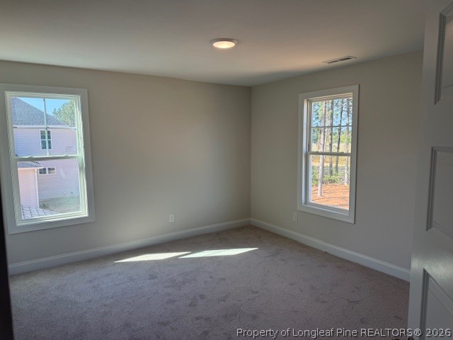 159 Rabbit Run Drive Smithfield, NC 27577 - Photo 11 of 21 an empty room with windows